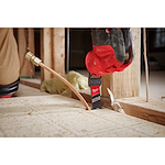 Worker using the NITRUS CARBIDE Extreme Materials Universal Fit OPEN-LOK Multi-Tool Blade to cut through plywood