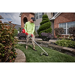 Image of a worker using the Milwaukee M18 FUEL 17” Dual Battery String Trimmer