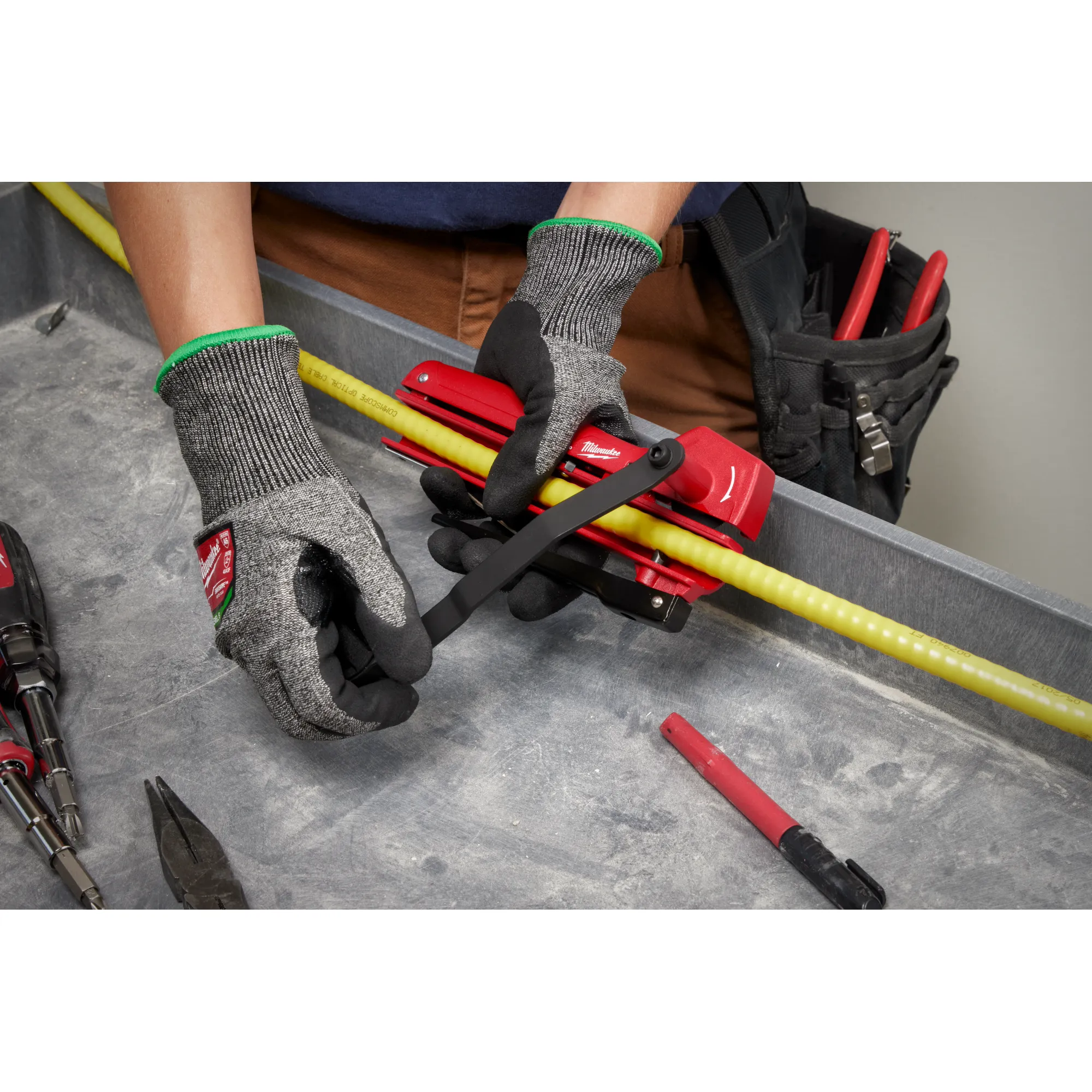 Image of a worker using the Milwaukee Armored Cable Cutter