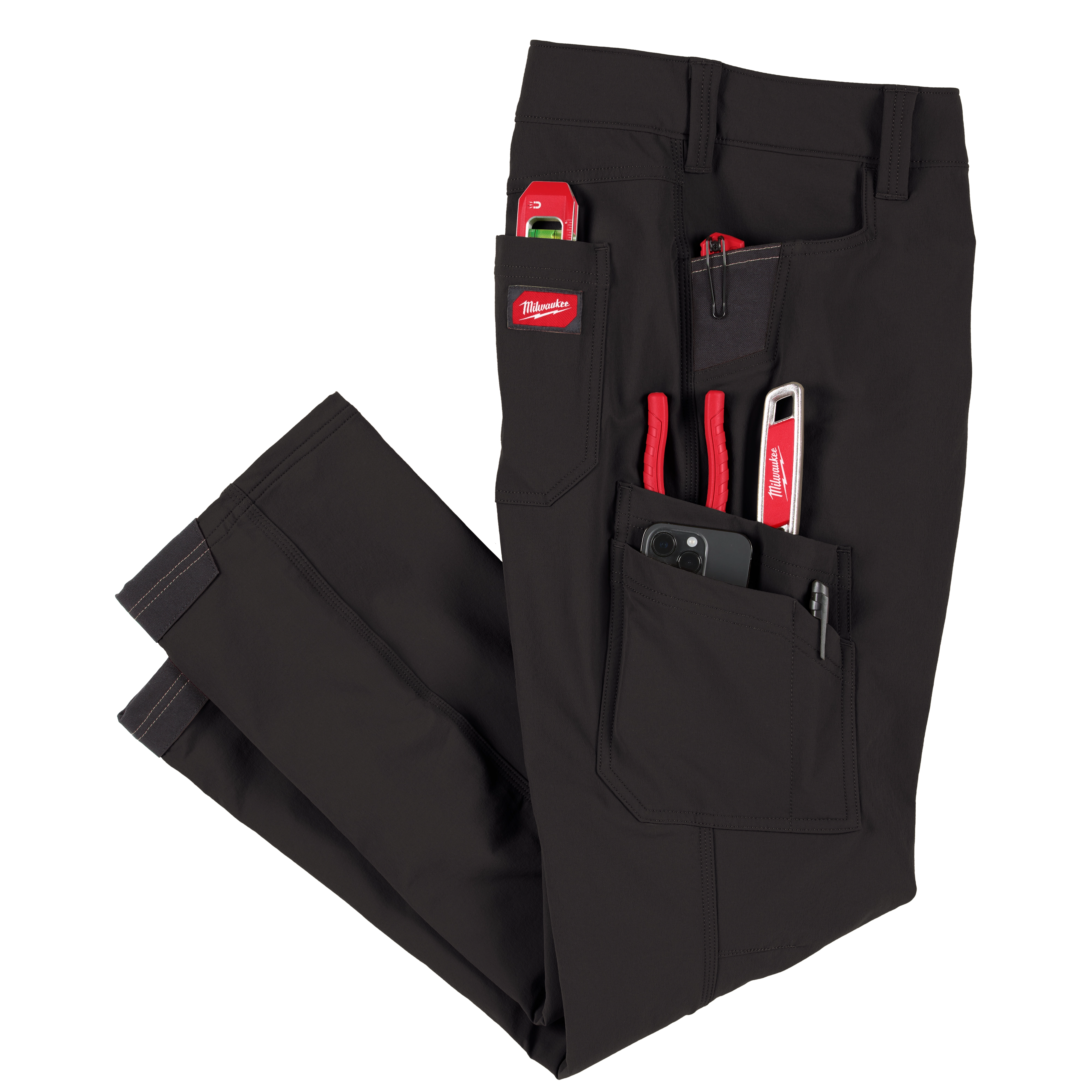 Black Milwaukee Tool work pants with Milwaukee Tool pliers in one pocket an a iPhone in the other