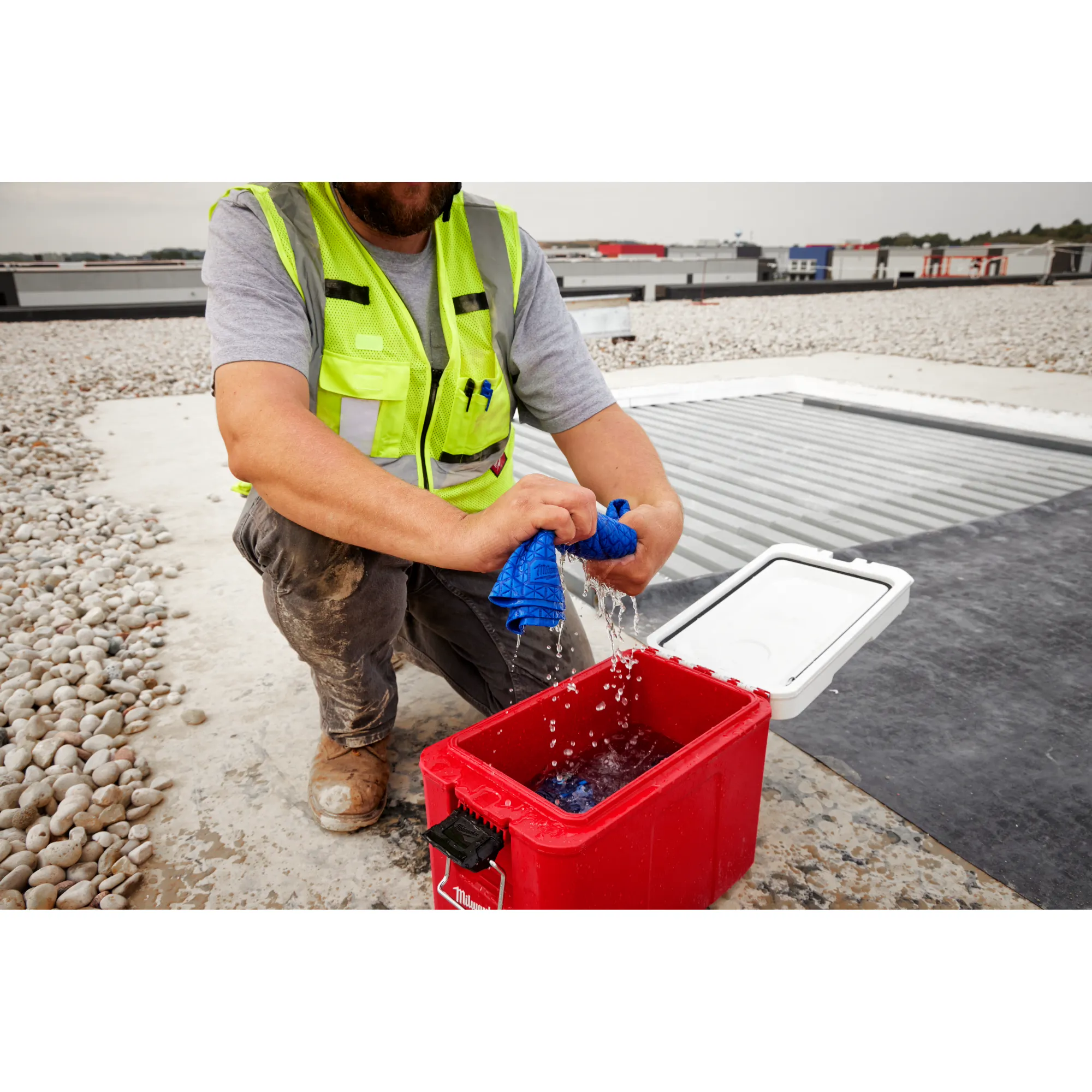 Image of a worker using the Milwaukee Cooling PVA Towel on a jobsite