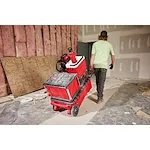 Image of a worker on the jobsite with the PACKOUT Rolling Toolbox with a PACKOUT Insulated Bottle with Chug Lid in red