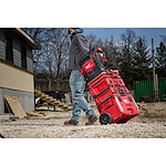 Image of the PACKOUT Rolling Toolbox being used by a worker on a jobsite highlighting the Low-Profile Handle feature