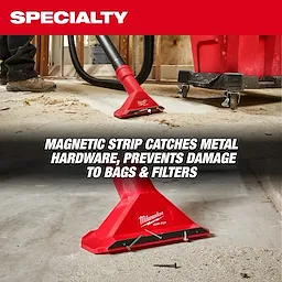 The image shows a red AIR-TIP™ 2 1/2" Magnetic Utility Nozzle in a construction setting. The nozzle has a magnetic strip to catch metal hardware, preventing damage to bags and filters. The text overlay reads, "MAGNETIC STRIP CATCHES METAL HARDWARE, PREVENTS DAMAGE TO BAGS & FILTERS."