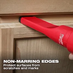 The image shows the AIR-TIP™ Non-Marring Utility Nozzle Kit being used on a wooden surface, emphasizing its non-marring edges that protect surfaces from scratches and marks. The product is red and is designed to prevent damage during use. Text on the image reads "NON-MARRING EDGES Protect surfaces from scratches and marks."