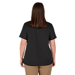 Rear view of a person wearing the Women's GRIDIRON™ Pocket T-Shirt - Short Sleeve Black. The T-shirt is plain black with short sleeves and a relaxed fit. The individual is also wearing tan pants.