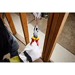 Image of the Milwaukee 1000V Insulated 9" Lineman's Pliers being used by an electrician