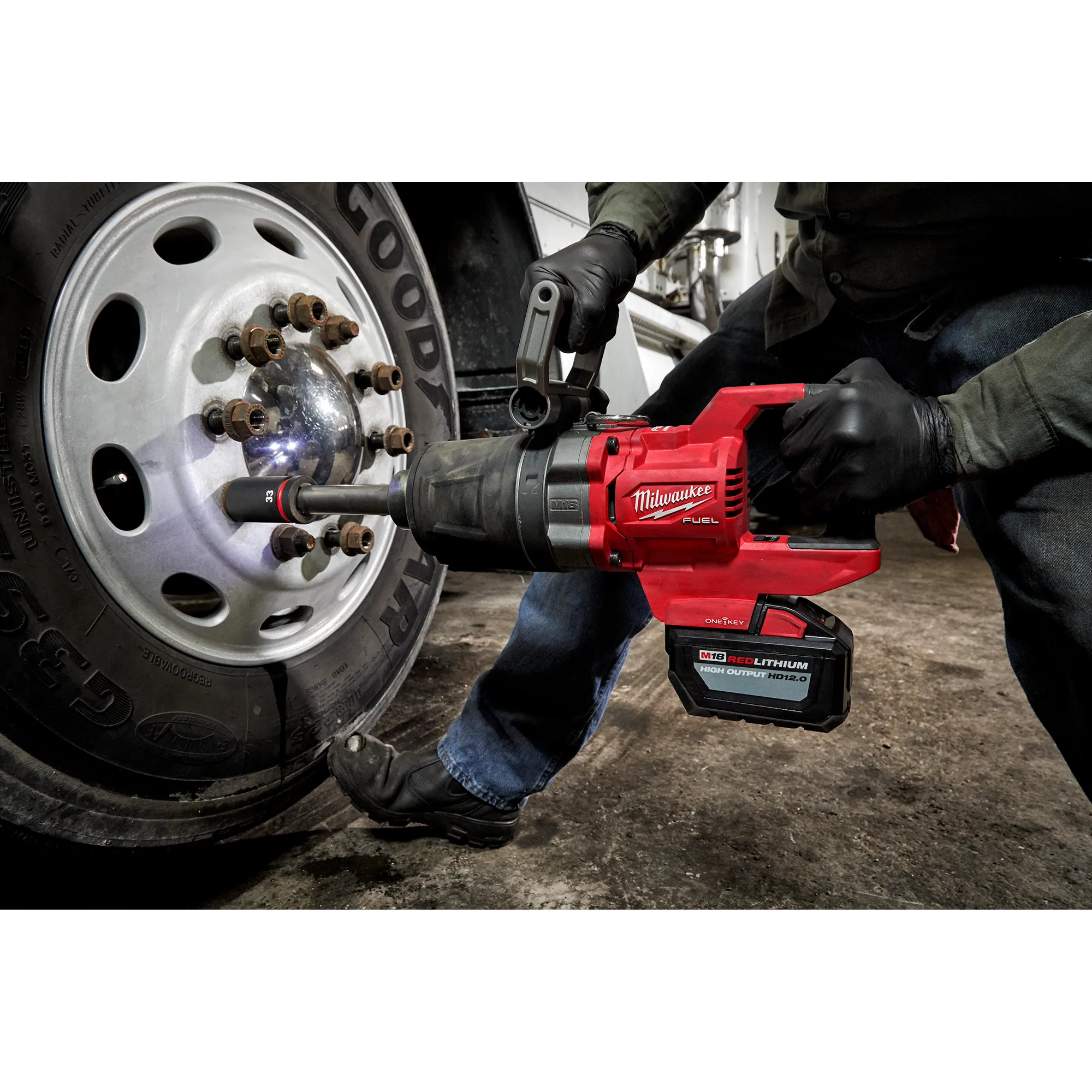 Worker using the M18 FUEL™ 1" D-Handle Ext. Anvil High Torque Impact Wrench w/ONE-KEY™