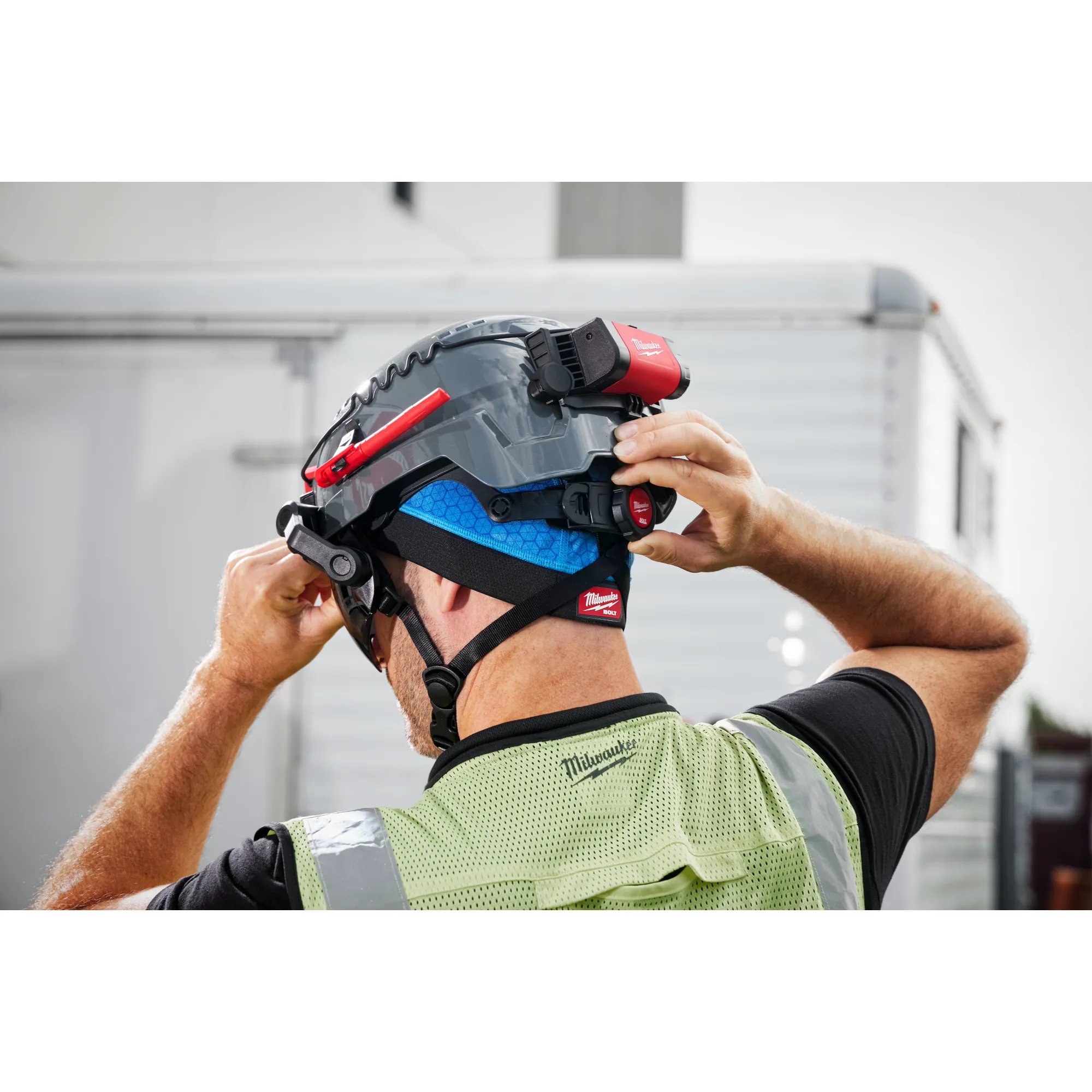 Image of a worker wearing a BOLT Cooling Skull Cap under a BOLT Hard Hat