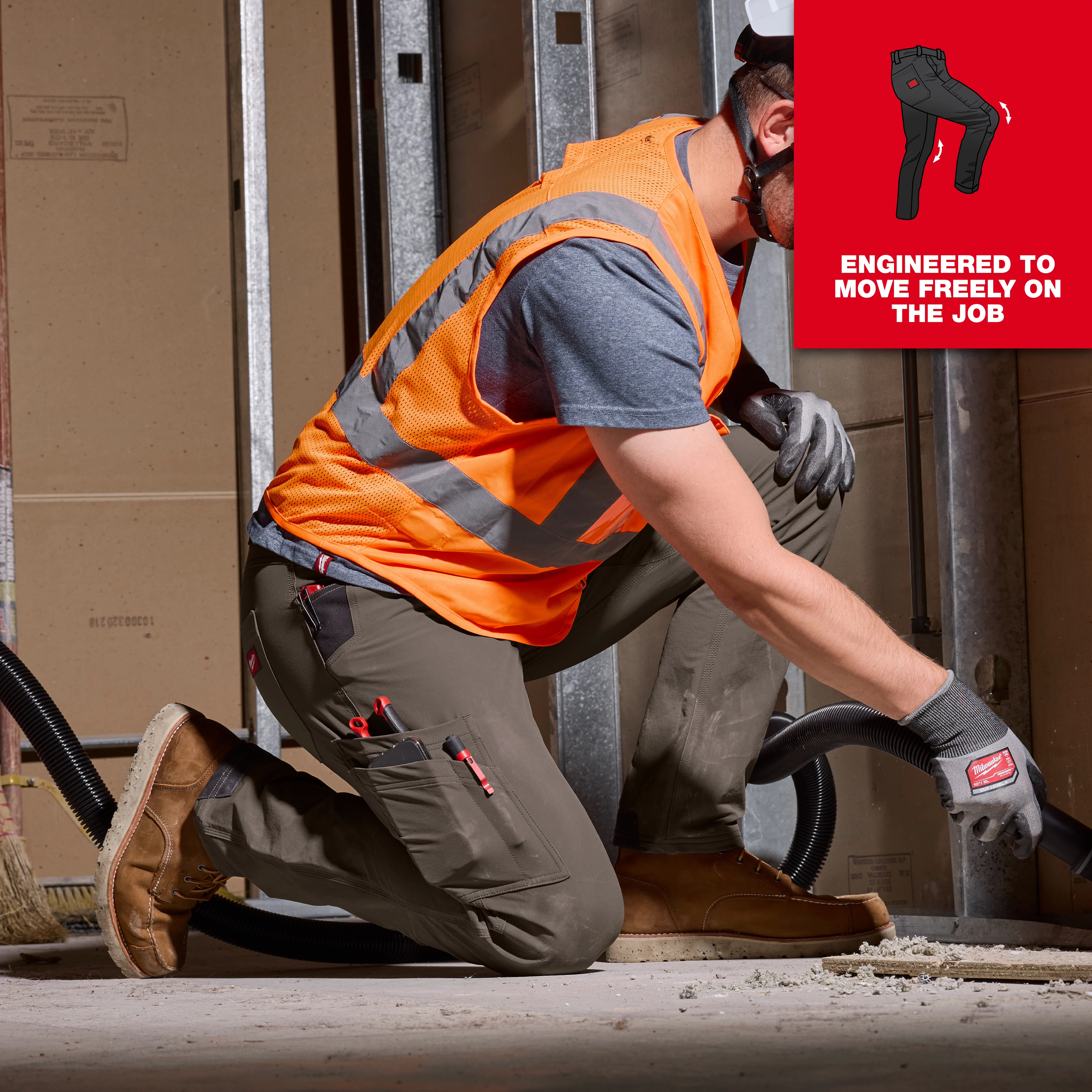 Image of a man wearing Milwaukee FREEFLEX™ Tech Pants on the jobsite