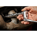 Image of the Milwaukee 3/8” Drive 5/8” Magnetic Spark Plug Socket being used by a mechanic on a car