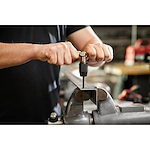 Worker using the Tap Collet for Taps up to 1/2” & T Handle Bar