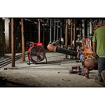 Worker using the M18 Brushless 18 inch fan on the jobsite to stay cool