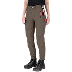 A person is wearing Women's GRIDIRON™ Double Knee Jogger Pants - Brown. The pants have multiple pockets and tools attached, such as a red utility knife, and are paired with black boots.