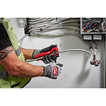 Image of a worker using the Milwaukee Armored Cable Cutter on wiring