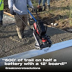 Worker smoothing concrete with a power trowel. Text: "500' of trail on half a battery with a 12' board!" @real