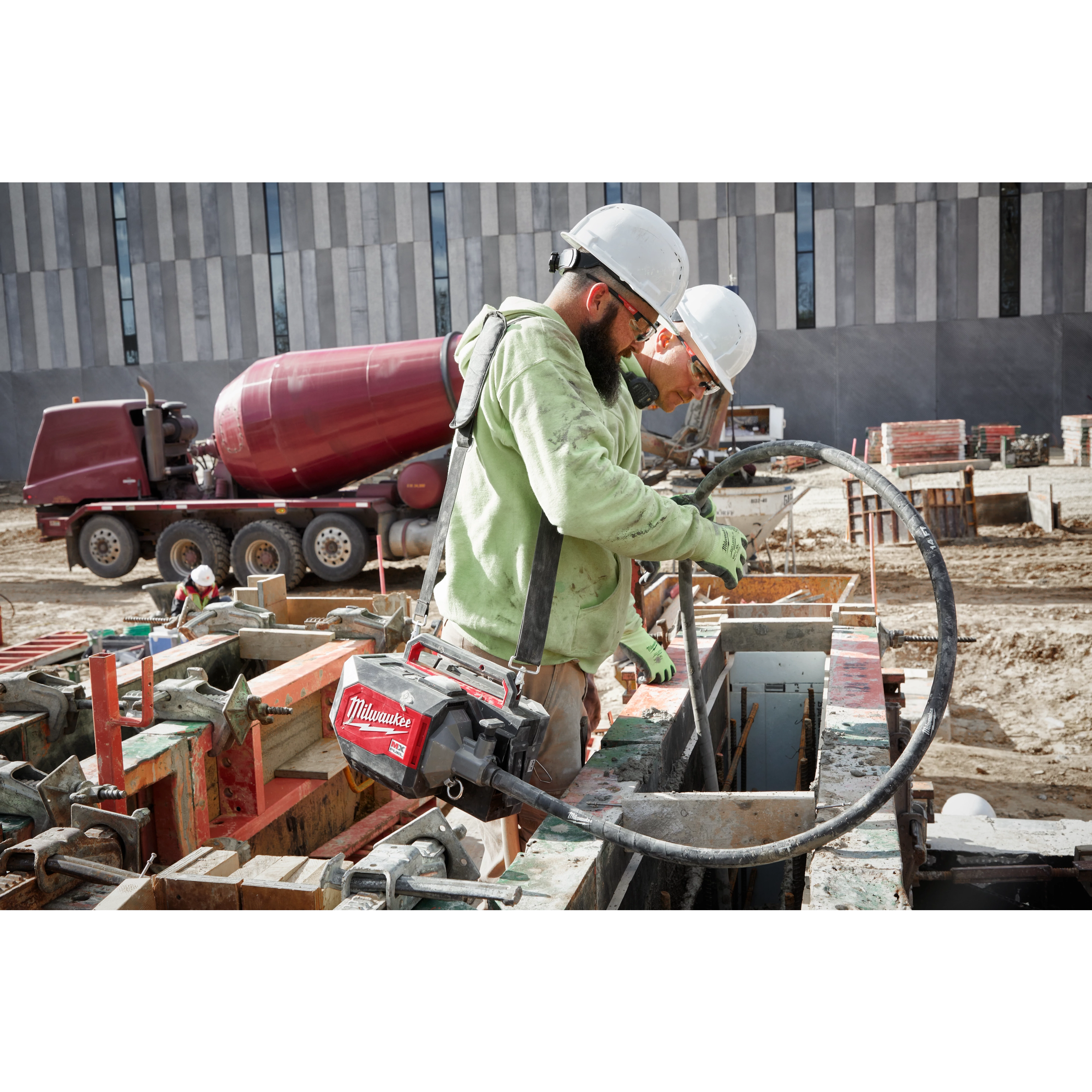 Worker using the MX Fuel Concrete Vibrator on the jobsite